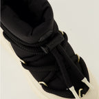 Image of the Moncler brand Altive Mid snow boots for Women - Autumn-Winter 2025 Season - Detailed top view