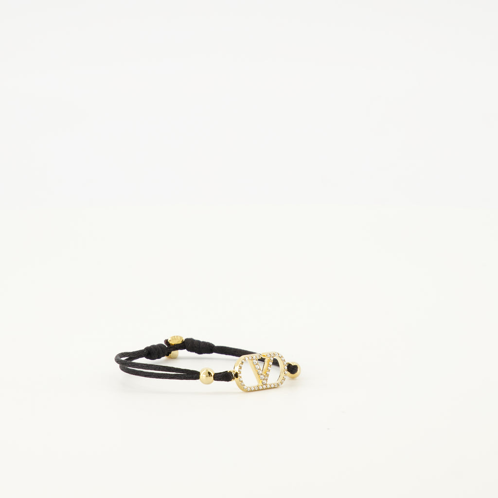 Image of the Vlogo bracelet with black cord and Swarovski® crystals by Valentino Garavani for Women - Spring-Summer 2026 - Detailed View 2