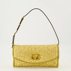 Immagine della piccola borsa DeVain in jacquard dorato del marchio Valentino Garavani per Donna - Collezione Primavera-Estate 2026 - Vista Frontale