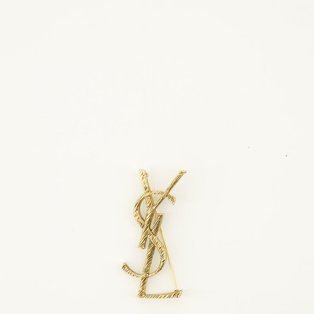 Bijoux Broche Cassandre doré en laiton Saint Laurent Doré Femme