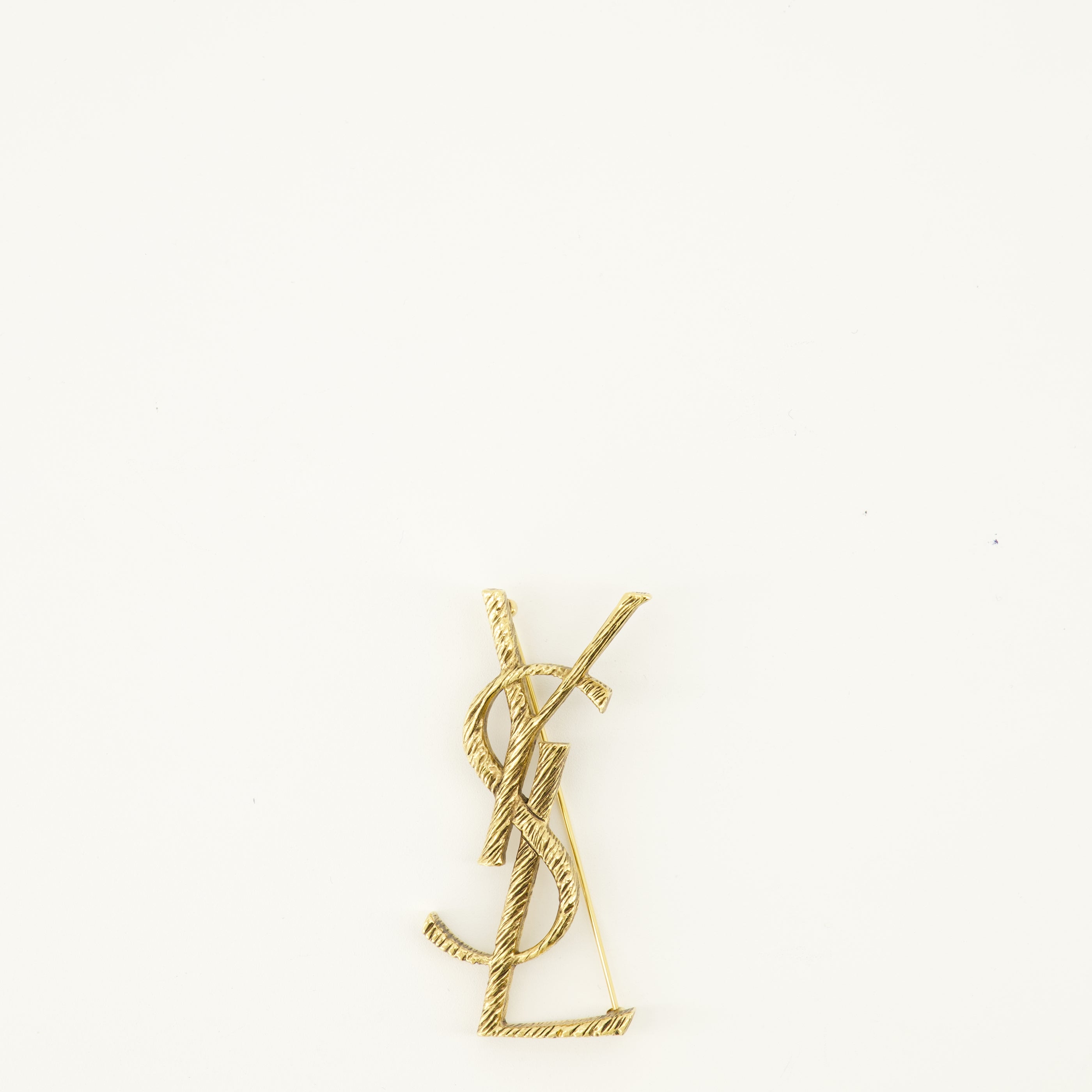 Bijoux Broche Cassandre doré en laiton Saint Laurent Doré Femme