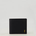 Image de l'article Portefeuilles Tiny Cassandre noir doré de la marque Saint Laurent pour Homme - Saison Printemps-Été 2026 - Vue de Face