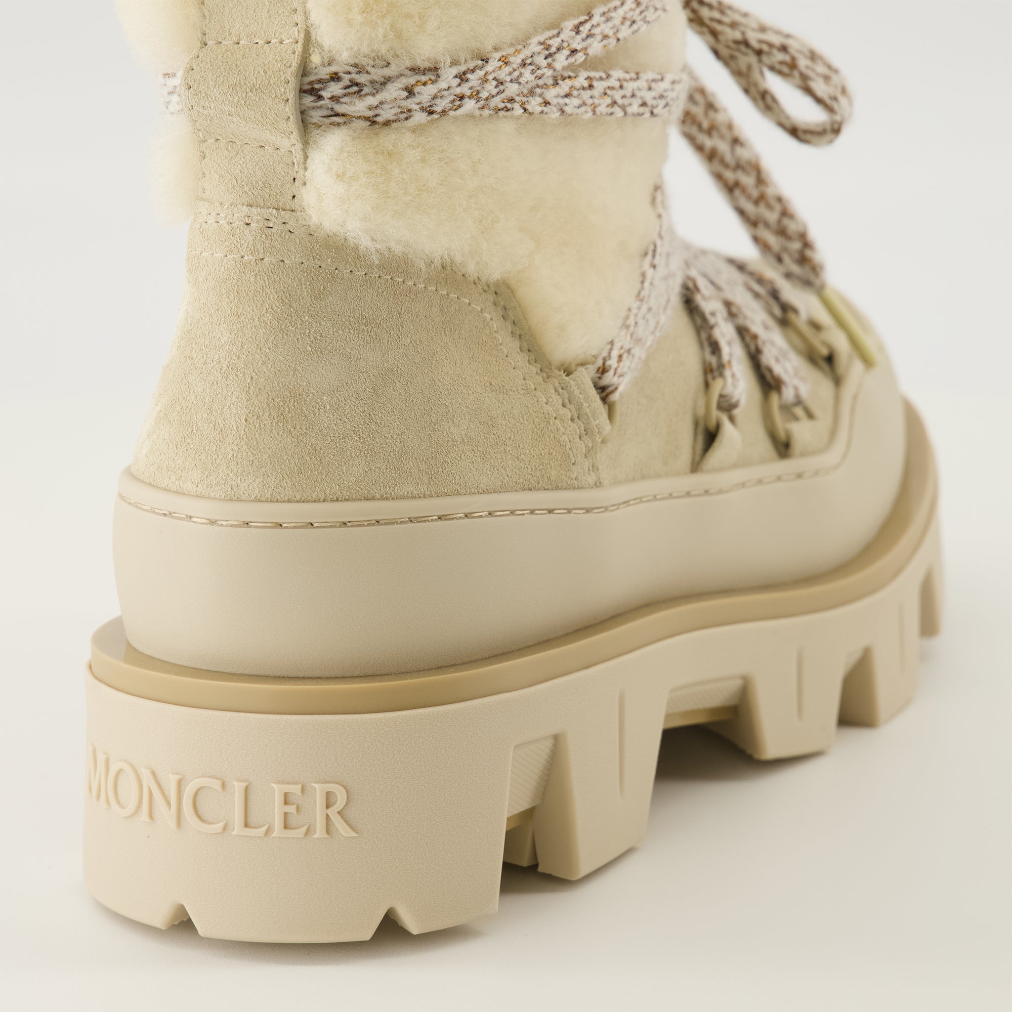 Image of the Moncler Peak suede and shearling boots for Women - Fall-Winter 2025 season - Back view