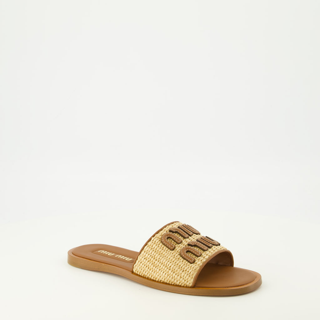 Image of the brown leather and raffia slipper from the Miu Miu brand for Women - Spring-Summer 2026 Season - Three-quarter front right view