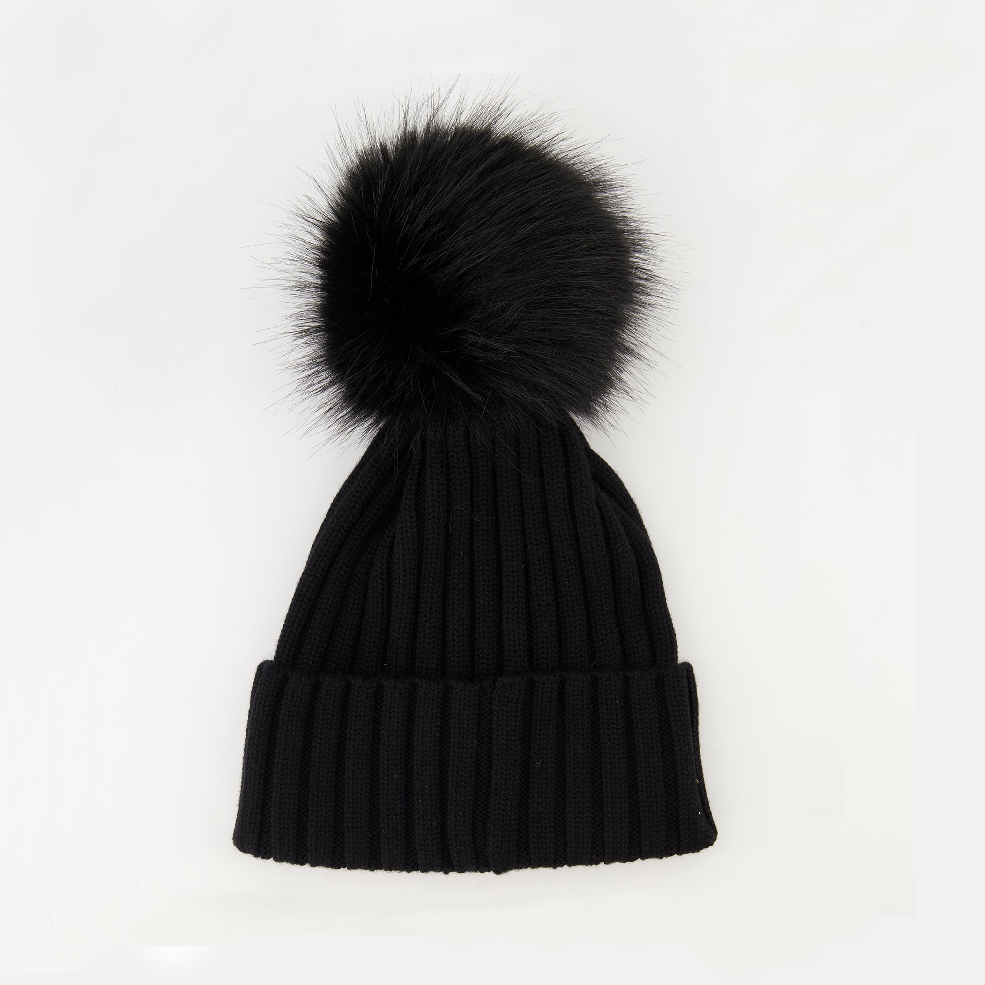 Image of the article Wool beanie with pompom from the brand Moncler for Women - Autumn-Winter Season 2025 - Back View