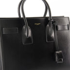 Sacs à main et épaule Kleine Schwarze Leder-Handtasche Saint Laurent Noir Femme