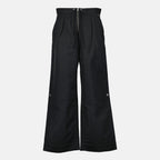 Image of the Ami PARIS brand zippered pants for men - Fall-Winter 2025 - Front view