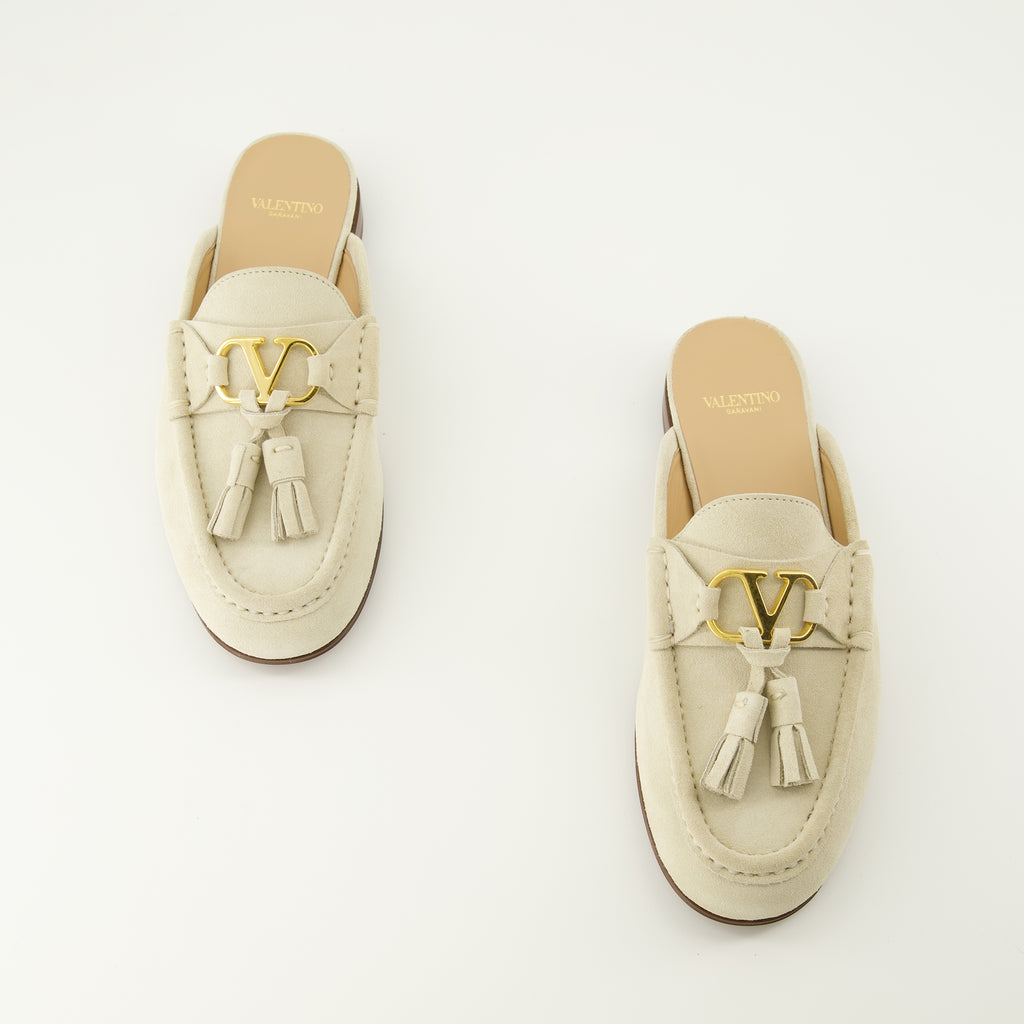 Immagine delle mules in pelle beige del marchio Valentino Garavani per donna - Stagione Primavera-Estate 2026 - Vista dall'alto della coppia di scarpe