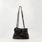 Immagine della piccola borsa Dada in pelle nera di Prada per Donna - Stagione Autunno-Inverno 2025 - Vista Frontale