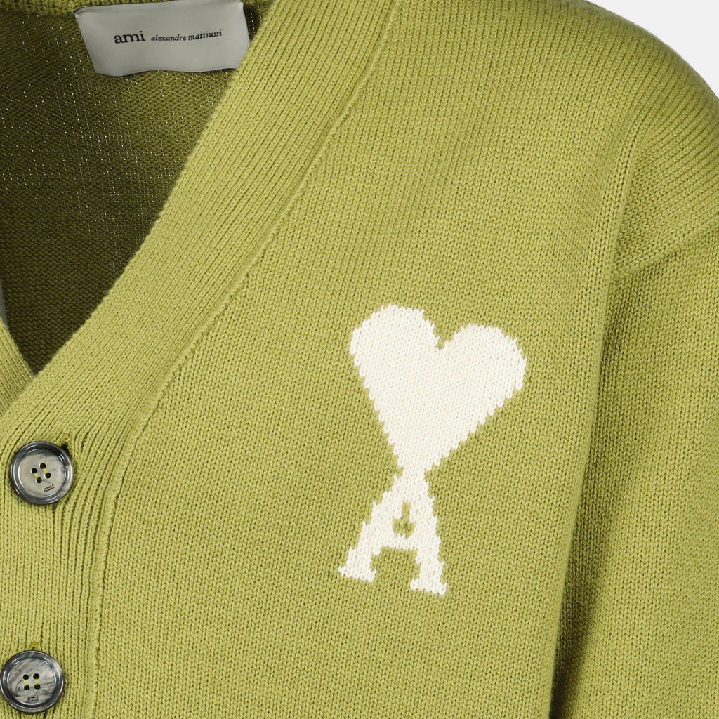 Image of the AMI heart green cardigan by Ami PARIS for Unisex - Spring-Summer 2026 - Detailed View_1