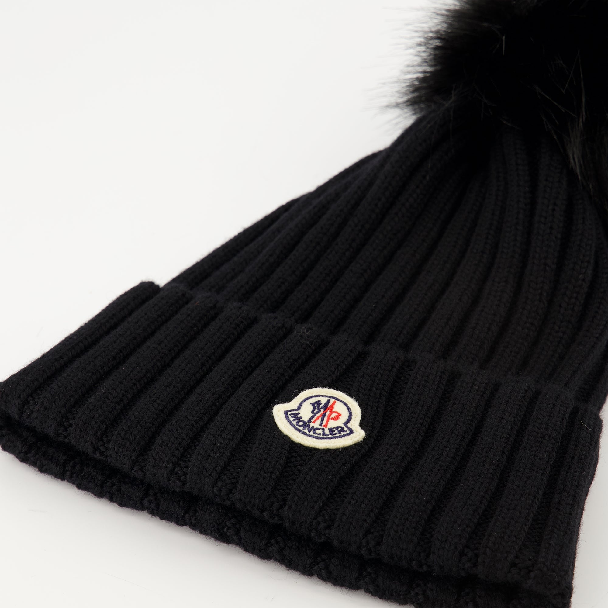 Image of the article Wool beanie with pompom from the brand Moncler for Women - Autumn-Winter Season 2025 - Detailed View_2