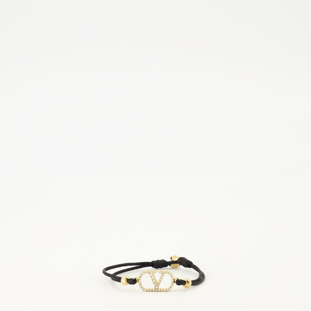 Image of the Vlogo bracelet with black cord and Swarovski® crystals by Valentino Garavani for Women - Spring-Summer 2026 - Front View