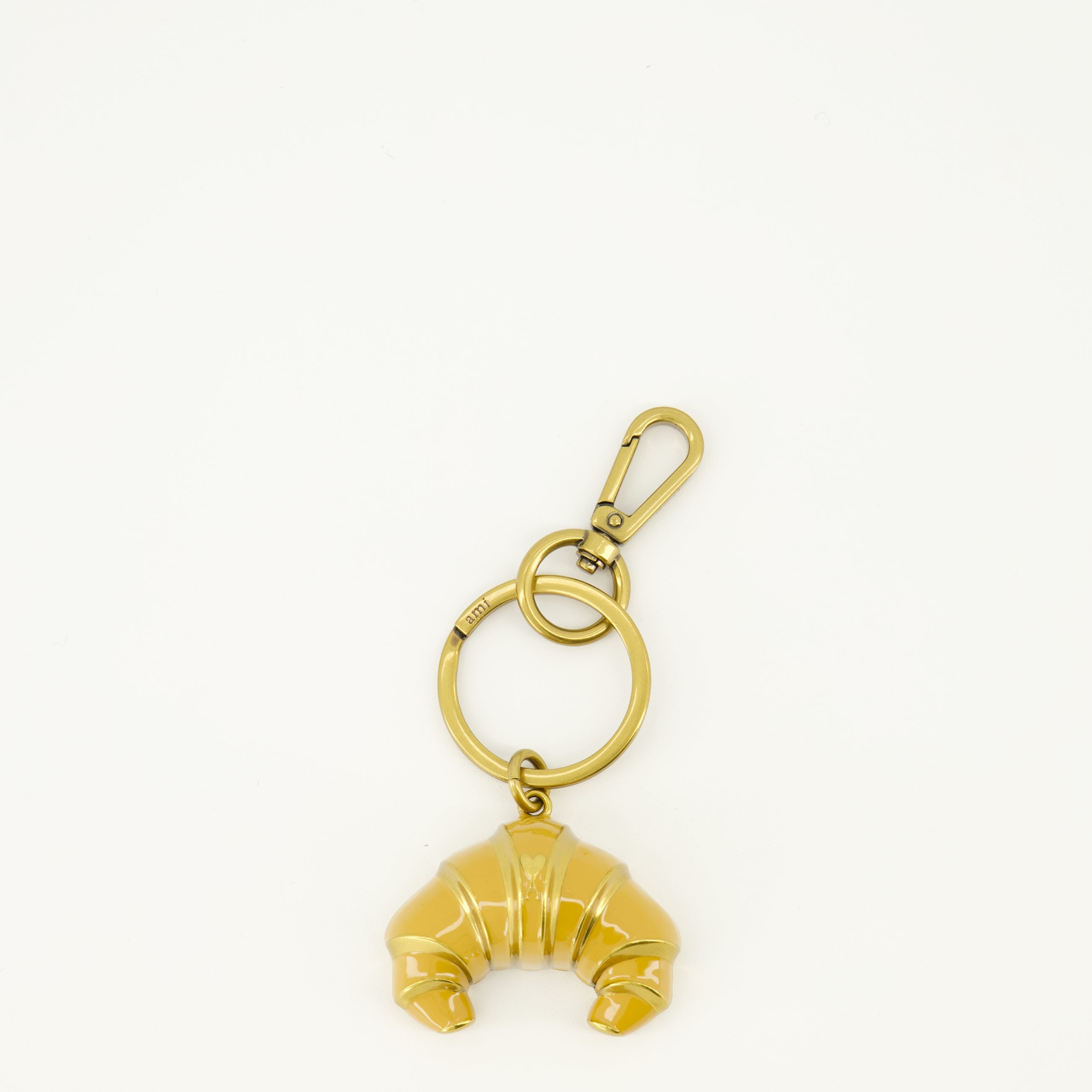Image of the Croissant metal keychain from the brand Ami PARIS for Unisex - Spring-Summer 2026 - Front View
