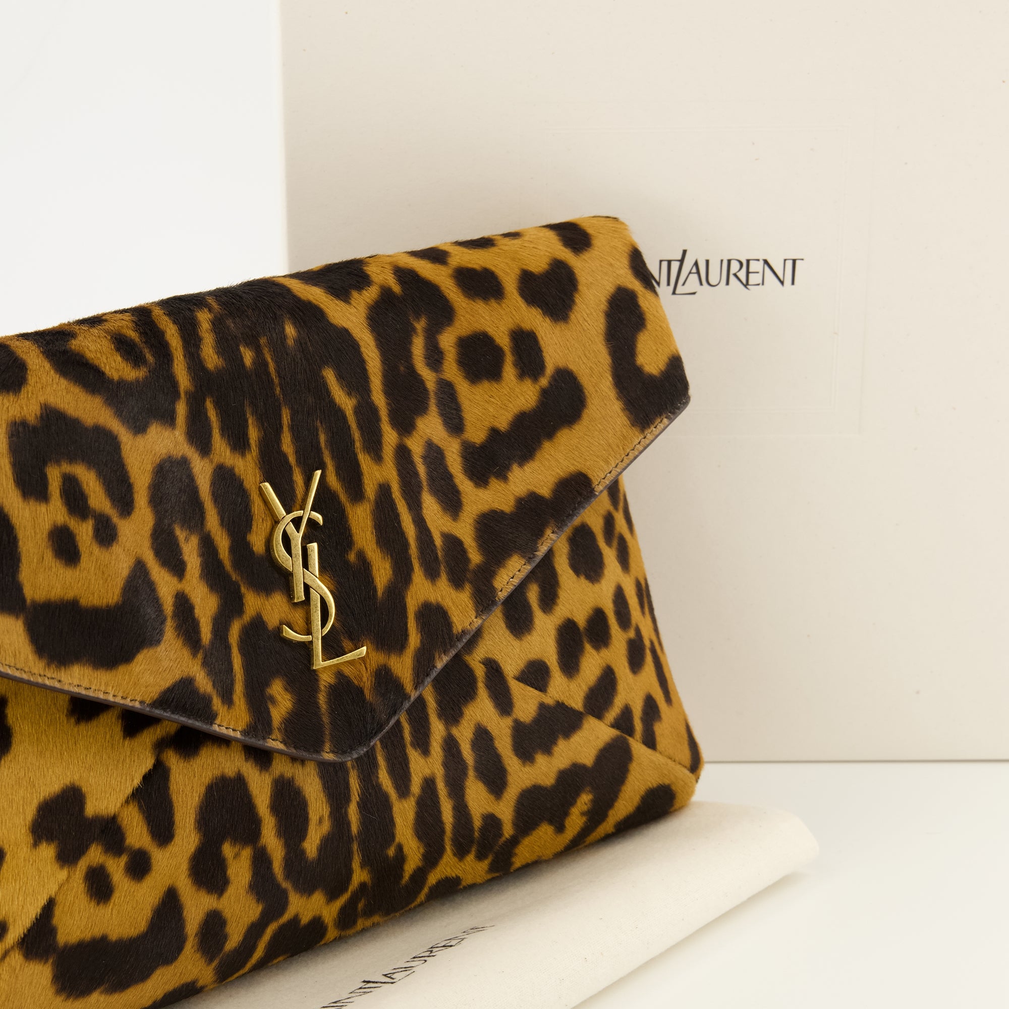 Image of the Cassandre brown pony effect pouch from the brand Saint Laurent for Men - Spring-Summer 2026 - Detailed View_2