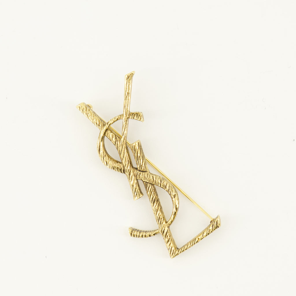 Bijoux Broche Cassandre doré en laiton Saint Laurent Doré Femme