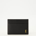 Immagine del portacarte Tiny Cassandre in pelle nera del marchio Saint Laurent per Uomo - Stagione Primavera-Estate 2026 - Vista Fronte