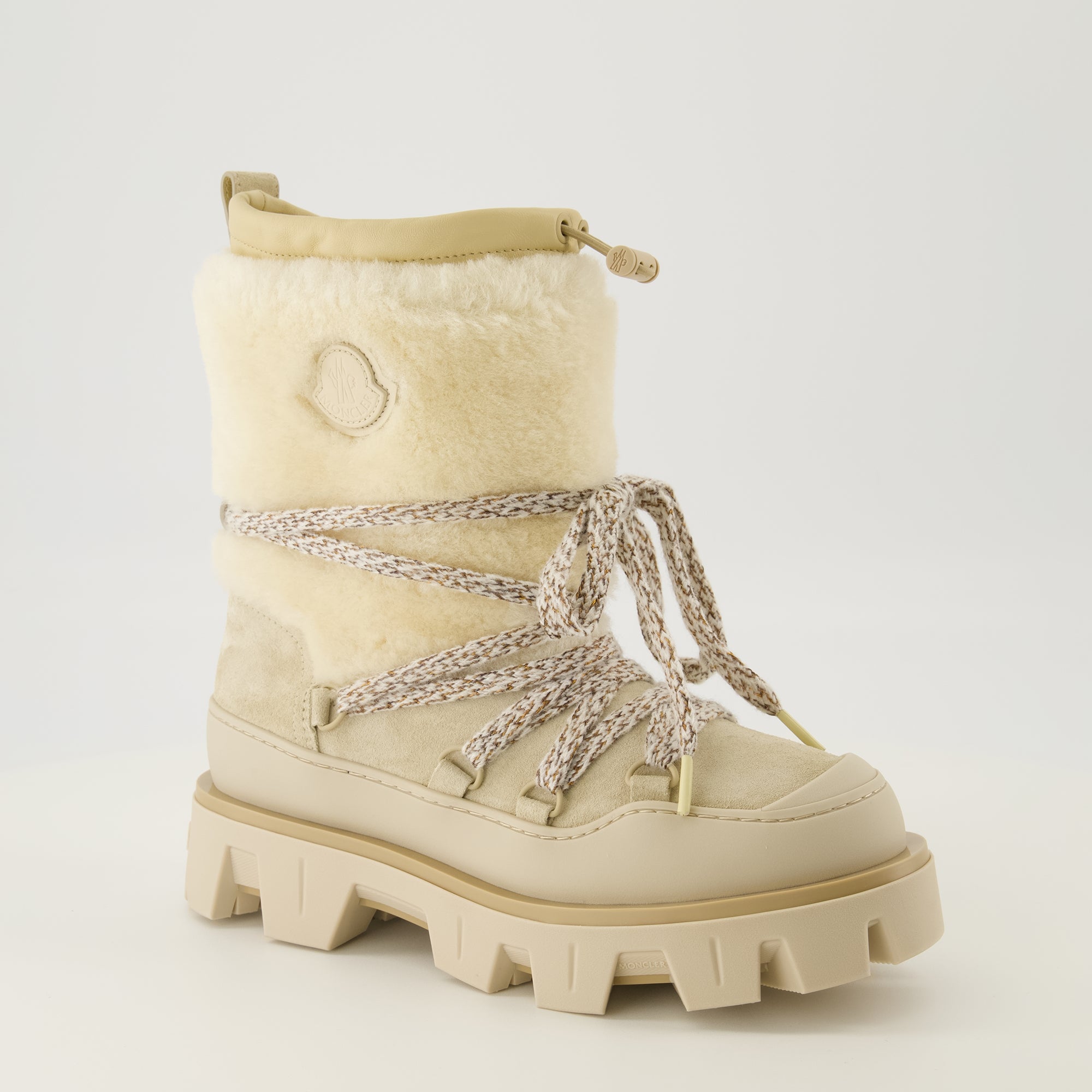 Image of the Moncler Peak suede and shearling boots for Women - Fall-Winter 2025 season - Three-quarter front right view
