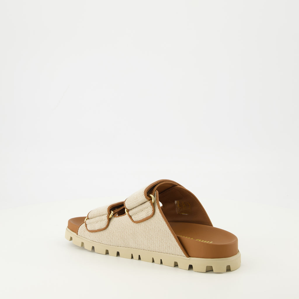 Image of the Miu Miu Beige Canvas Mules for Women - Spring-Summer 2026 - Three-Quarter Back Right View