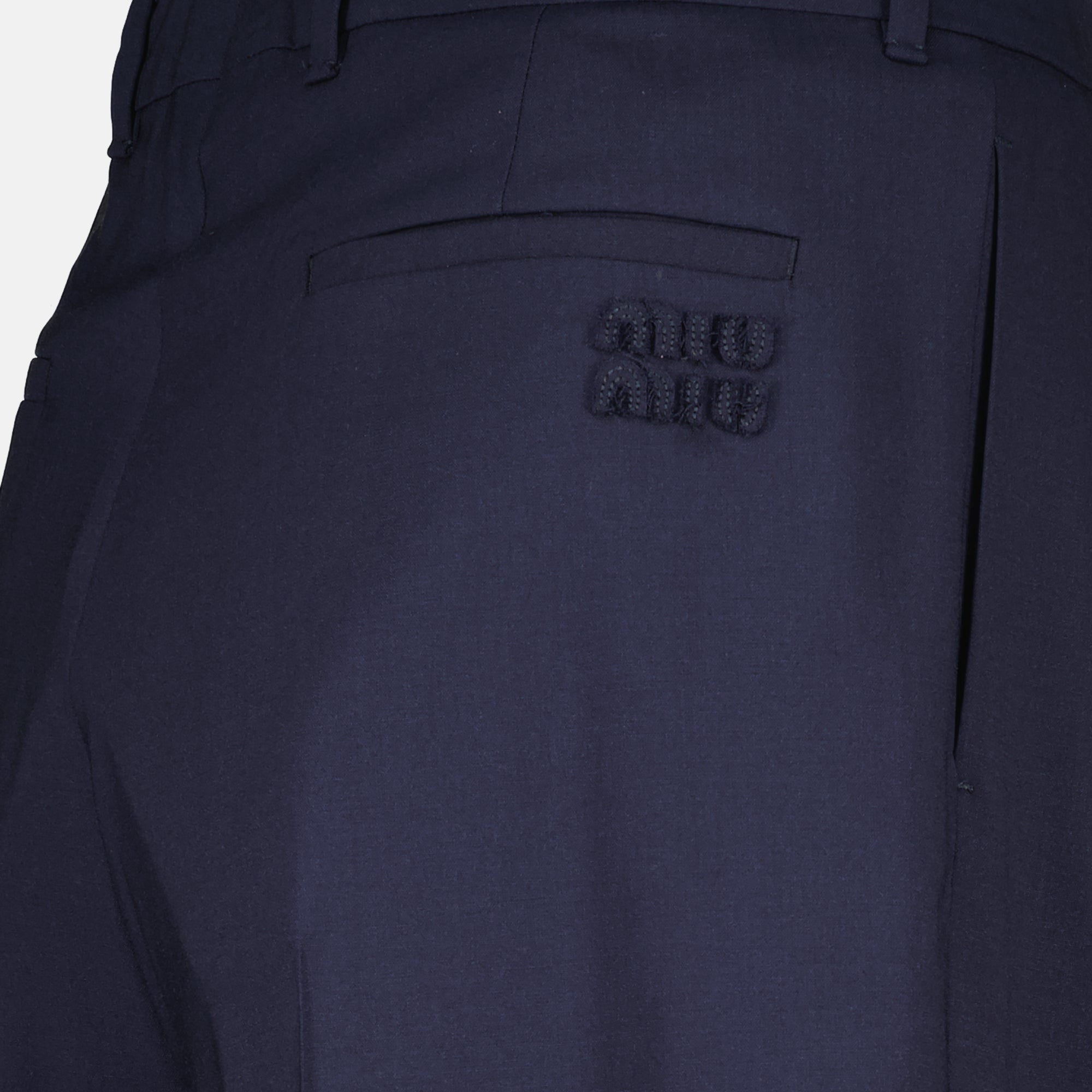Image of the article Navy blue wool trousers by the brand Miu Miu for Women - Spring-Summer 2026 - Detailed View_1
