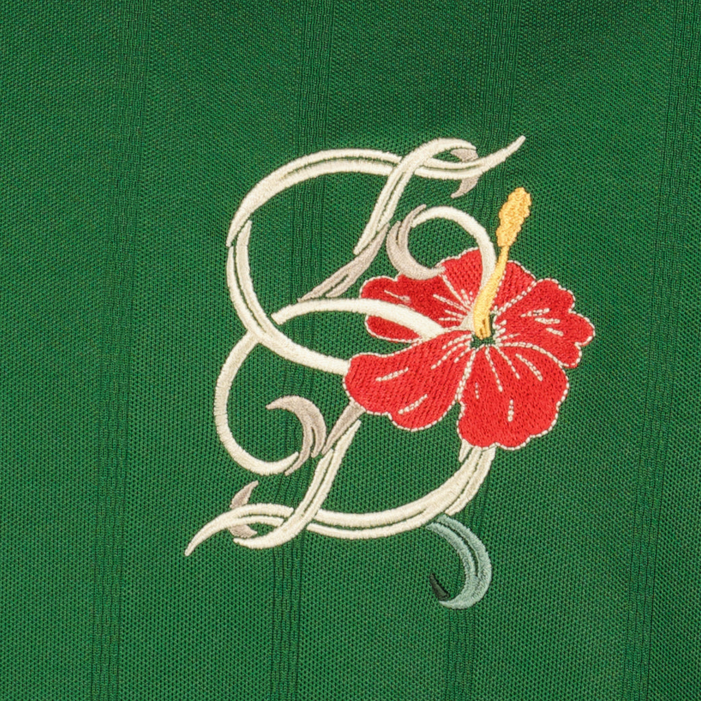 Image de l'article Polo D-Hibiscus vert en coton de la marque Drole De Monsieur pour Homme - Saison Printemps-Été 2026 - Vue détaillée_1