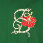 Immagine del polo D-Hibiscus verde in cotone del marchio Drole De Monsieur per Uomo - Collezione Primavera-Estate 2026 - Vista Dettagliata_1