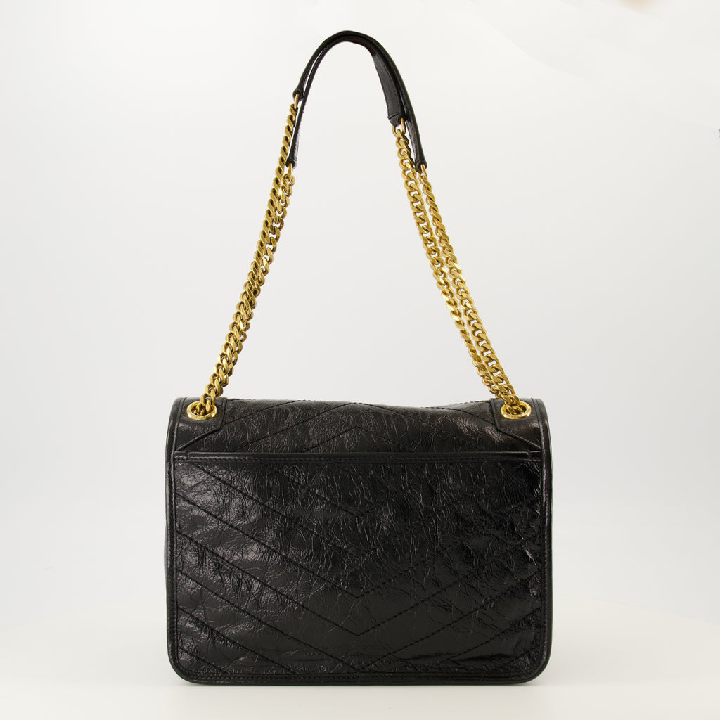 Image de l'article Sac Niki medium en cuir vintage de la marque Saint Laurent pour Femme - Saison Automne-Hiver 2025 - Vue de Dos