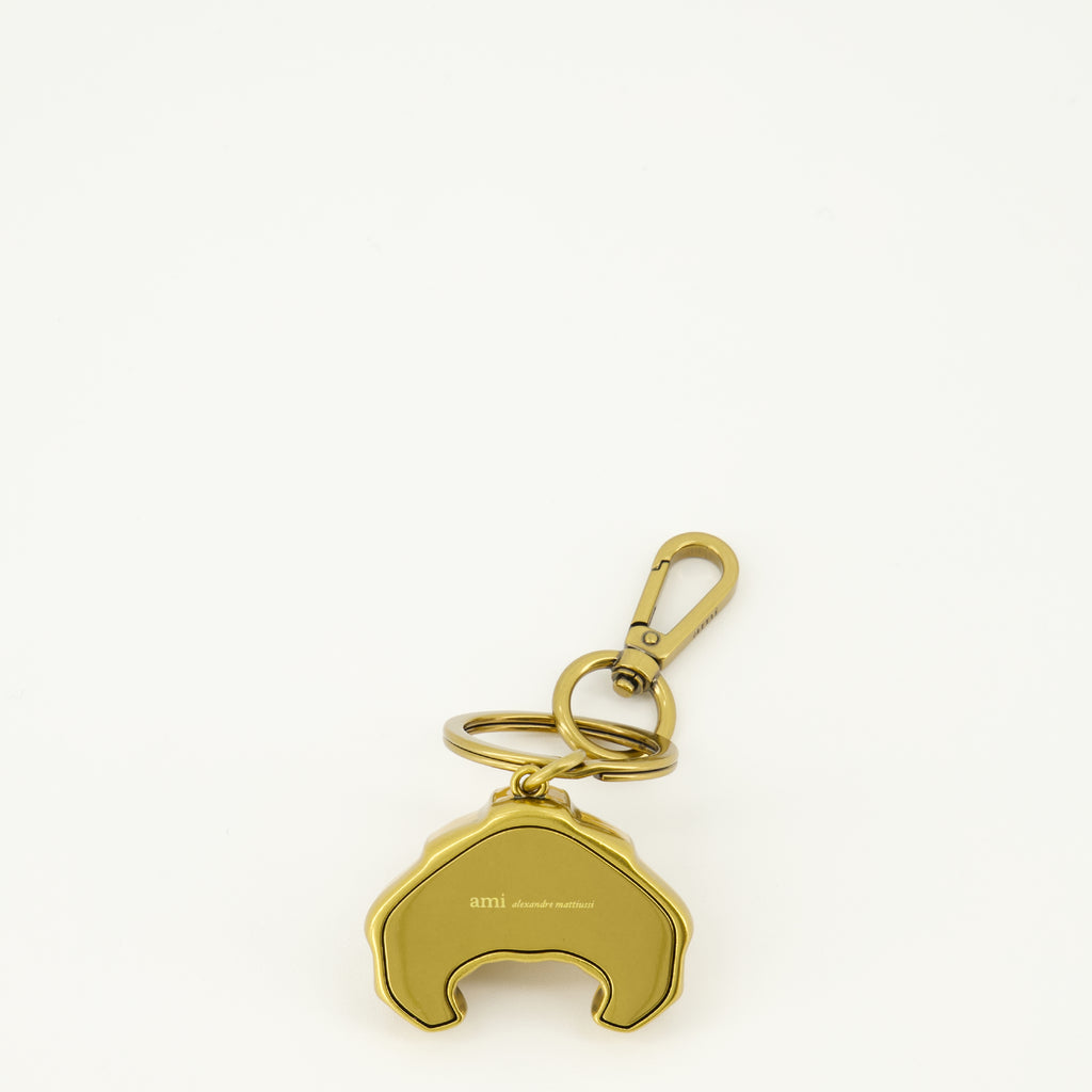 Imagem do porta-chaves em metal em forma de croissant da marca Ami PARIS para Unisex - Temporada Primavera-Verão 2026 - Vista Traseira