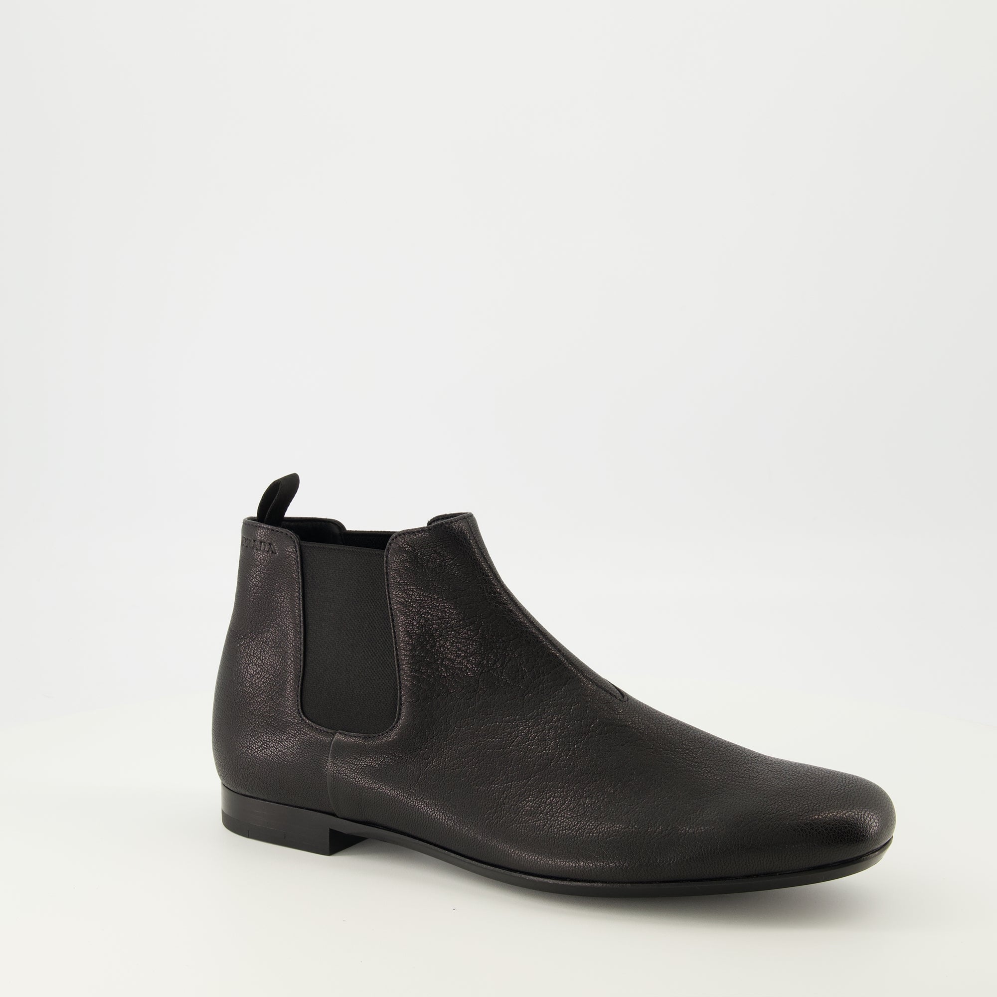 Image of the black leather Chelsea boots by Prada for Men - Spring-Summer 2026 - Front right three-quarters view