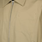 Image of the beige AMI heart jacket from the brand Ami PARIS for Men - Spring-Summer 2026 - Detailed View_1