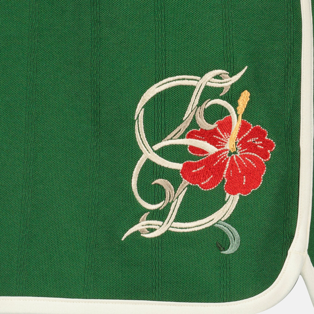 Image of the D-Hibiscus green cotton shorts from the brand Drole De Monsieur for Men - Spring-Summer 2026 - Detailed View_1