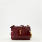 Imagem da bolsa Sunset em couro verniz bordô da marca Saint Laurent para Mulher - Temporada Outono-Inverno 2025 - Vista Frontal