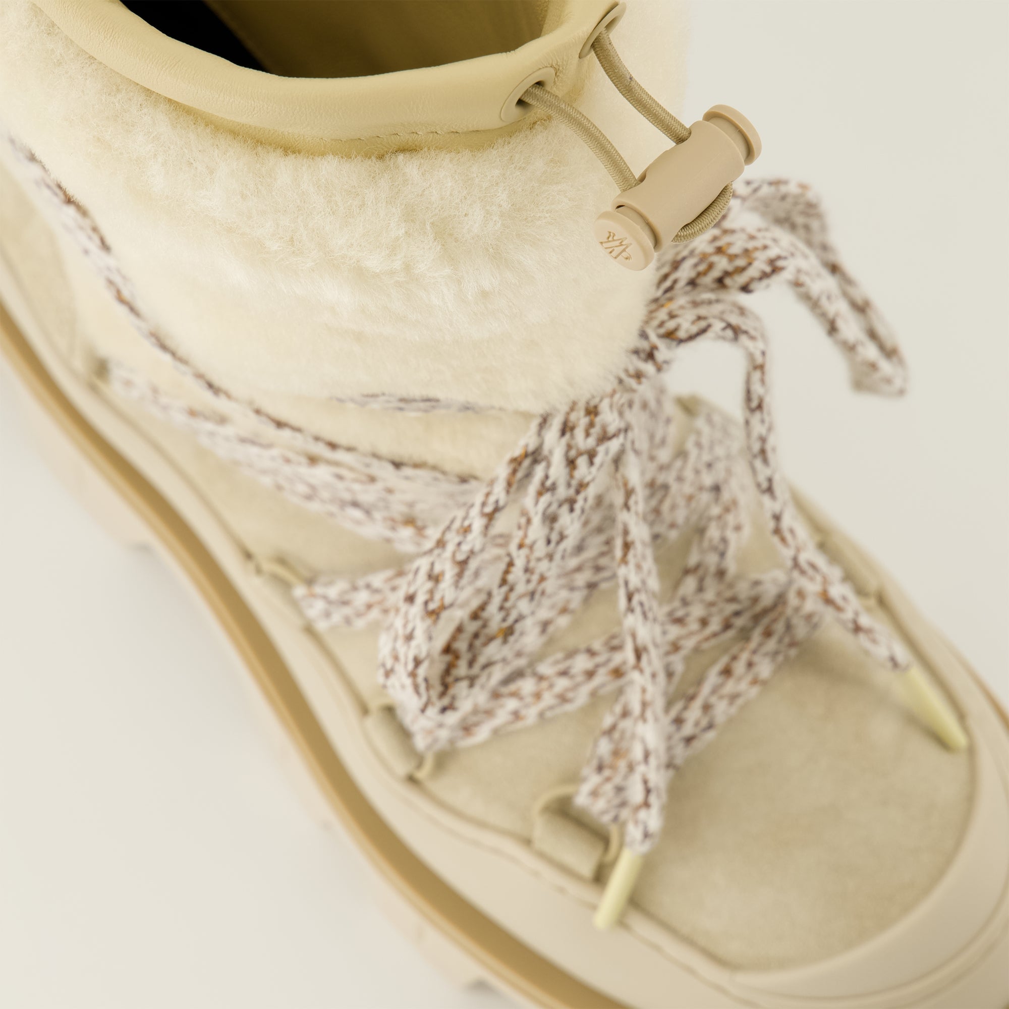 Image of the Moncler Peak suede and shearling boots for Women - Fall-Winter 2025 season - Detailed top view