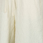 Imagem do short monograma branco da marca Drole De Monsieur para Homem - Temporada Primavera-Verão 2026 - Vista Detalhada 1
